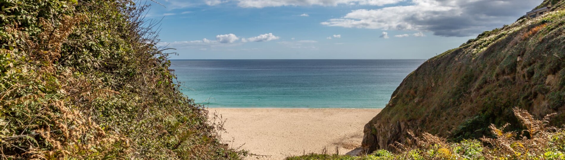 Pathway leading to sandy beach at Porthcurno on the Cornish coast